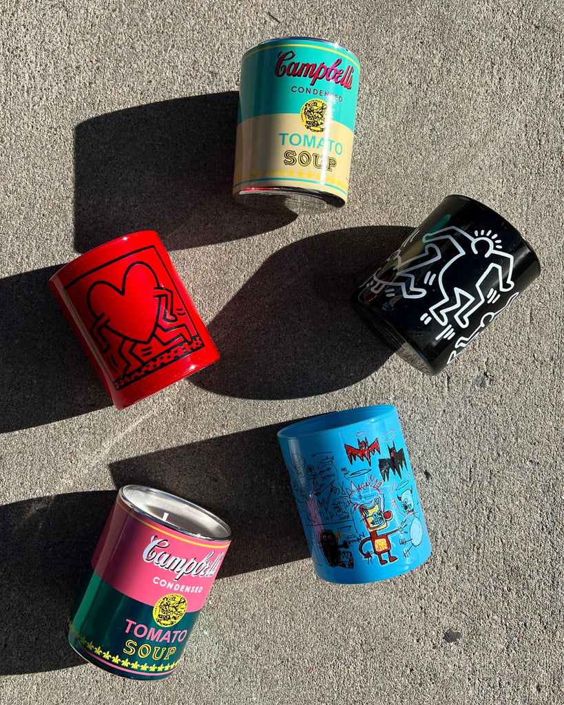 5 Artist Candles with art from Basquiat, Keith Haring, and Andy Warhol. 