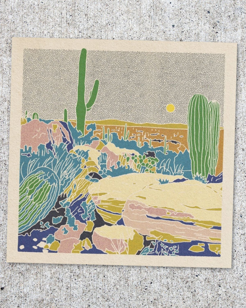 The print is shown on a cement background. 
