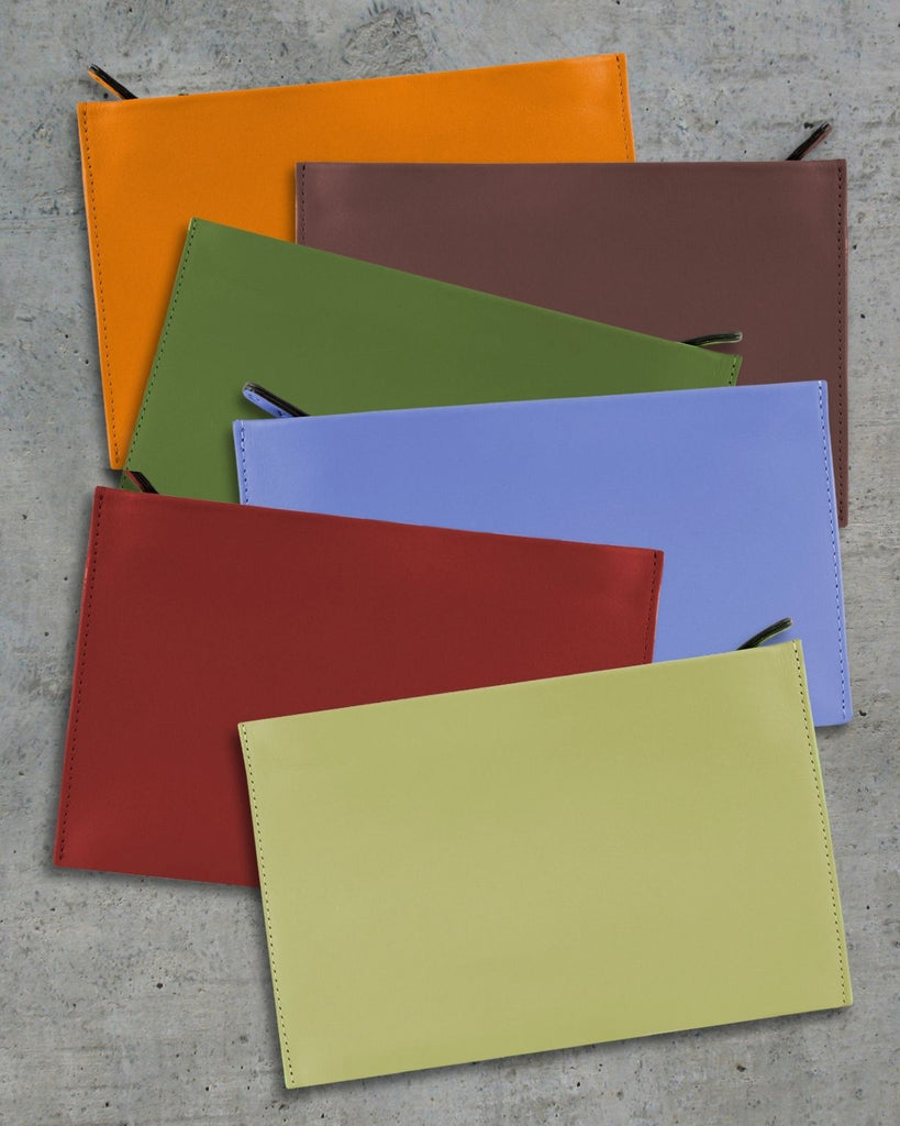 Leather pouches shown in the different colors available, orange, olive green, sky blue, ruby red, and pear green. 