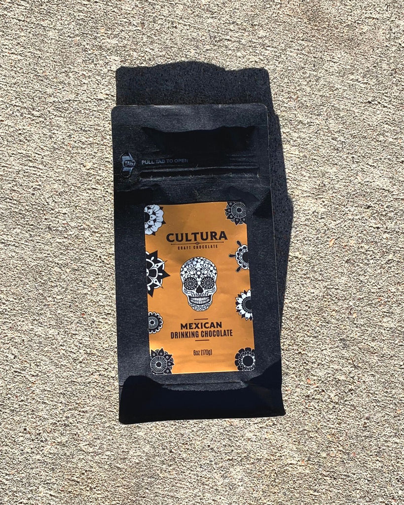 Mexican Drinking Chocolate in black paper packaging with an orange branded sticker