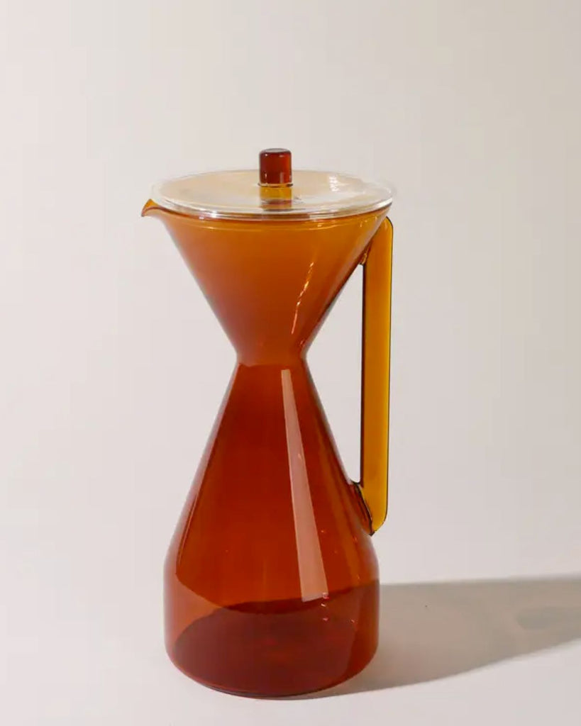 Amber Carafe on a cream surface. 