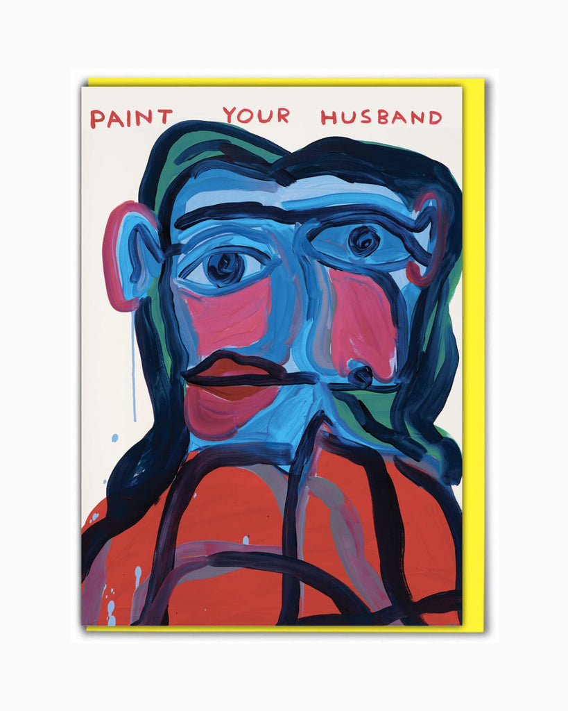 Artist designed card by David Shrigley. They card has an abstract painting of a man with blue skin, an orange striped shirt , asymmetrical eyes, and an off center mouth. Red handwritten text on the top reads 'Paint your husband". 