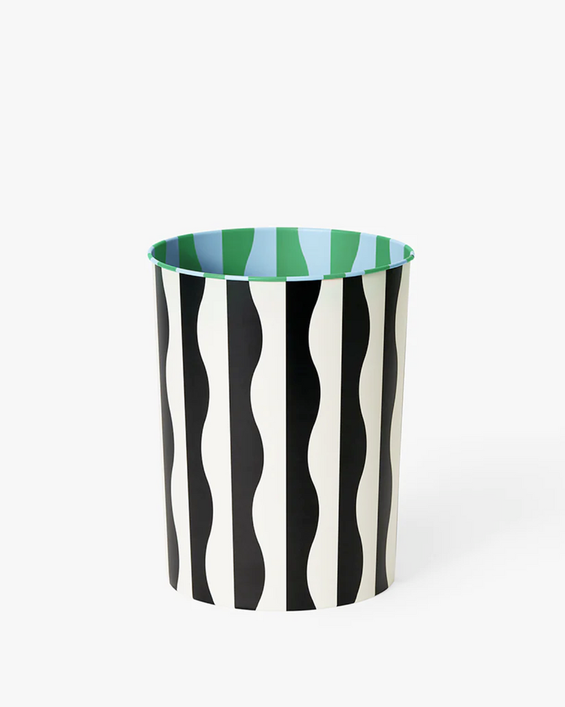 Wavy pattern bin against a white backdrop. The bin has a black and white wavy pattern on the outside. On the inside, it has the sames pattern but with blue and green colors. 