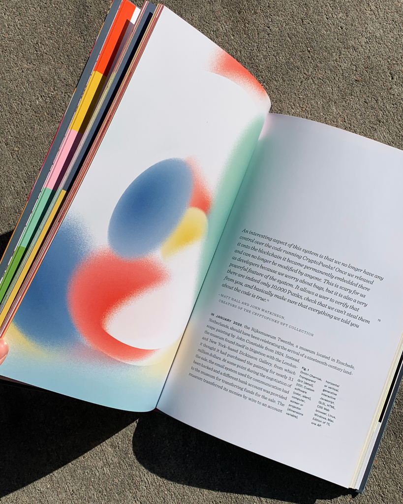 NFT book opened showing a page with abstract digital artwork and a page with text.