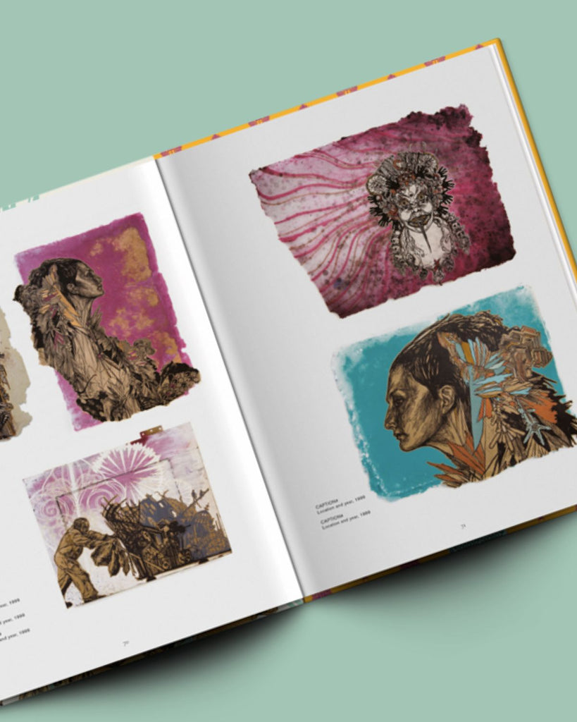 A view of the book opened to pages of artwork. 