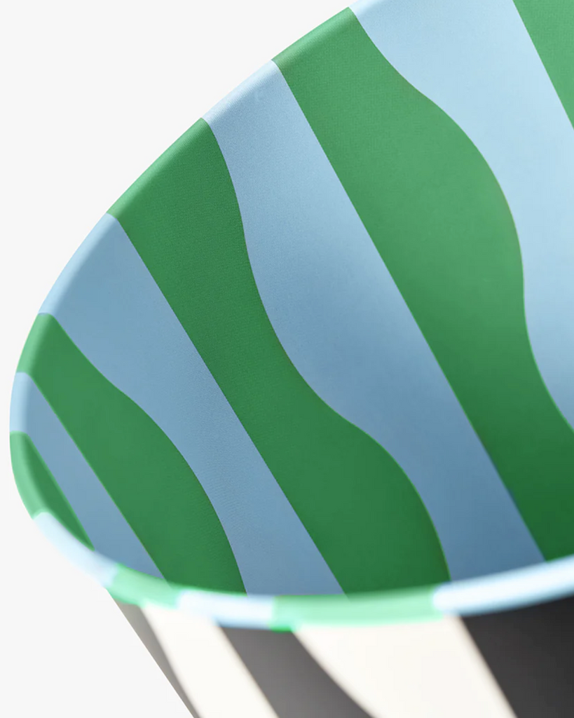 Close up view of the inside of the bin. Light blue and green patterned waves.