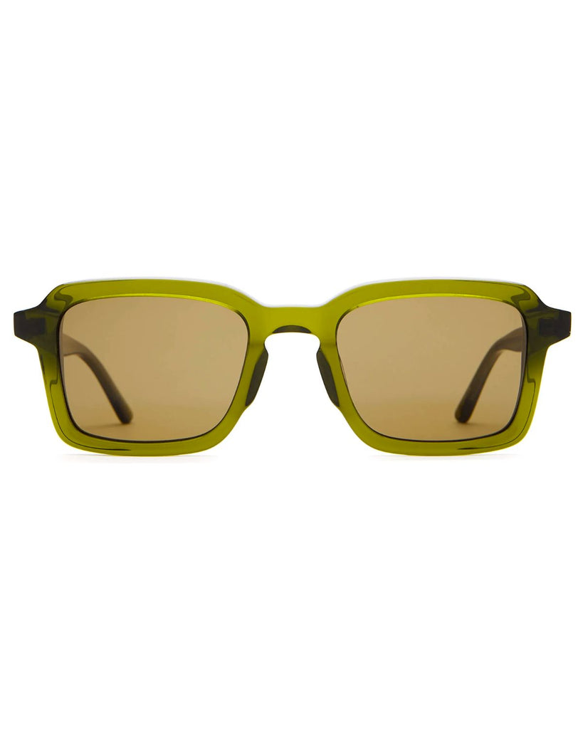 The Heavy Tropix Sunglasses in Crystal Olive have a larger square frame. The frame is a translucent olive green and the lens is a clear brown color. 