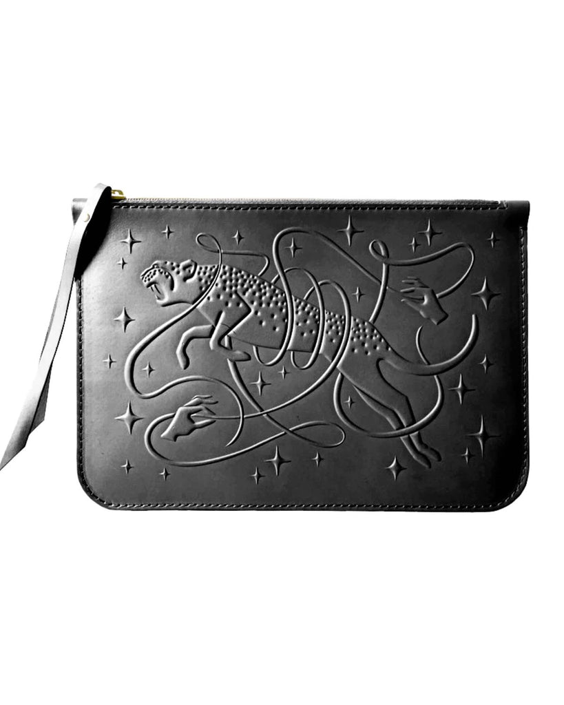 The black pouch has an embossed leopard and stars with a ribbon weaving throughout and two hands holding each end of the ribbon.