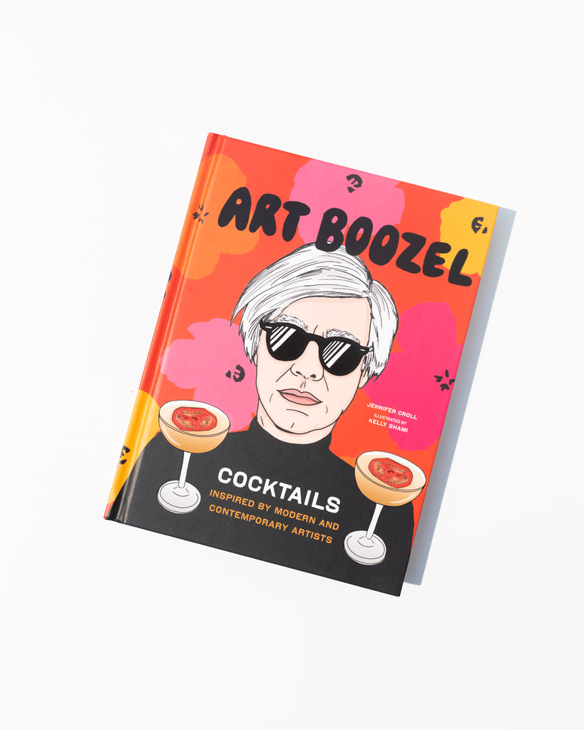 The book cover has a graphic of Any Warhol wearing sunglasses in from of a multi-colored floral background. Two cocktails are anchored at the bottom and in between them, text reads 'Cocktails inspired by modern and contemporary artists'. The title of the book, Art Boozel is on the top of the graphic. 